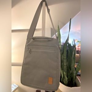 Gray laptop bag with strap or hidden handles